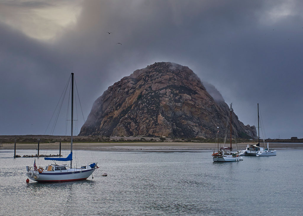 Morro Rock about to enveloped by rolling sea fog